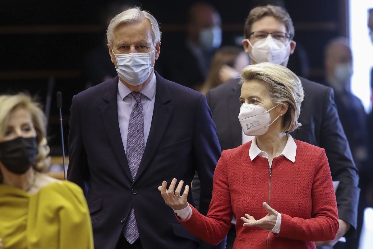 European Commission President Ursula von der Leyen, right, and Head of the Task Force for Relations with the UK Michel Barnier, second left, arrive for a debate on the EU-UK trade and cooperation agreement during the second day of a plenary session at the European Parliament in Brussels, Tuesday, April 27, 2021.  (Olivier Hoslet)