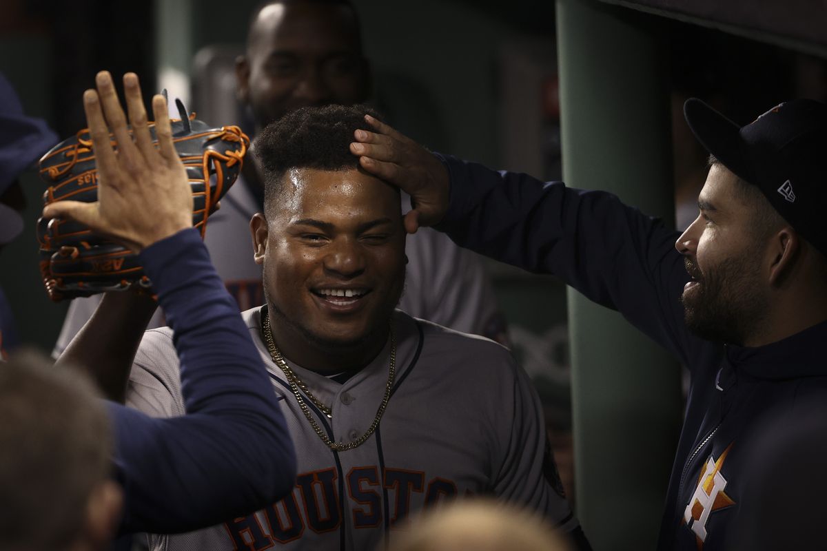 Houston Astros starting pitcher Framber Valdez celebrates in the dugout after the eighth inning in Game 5 of baseball