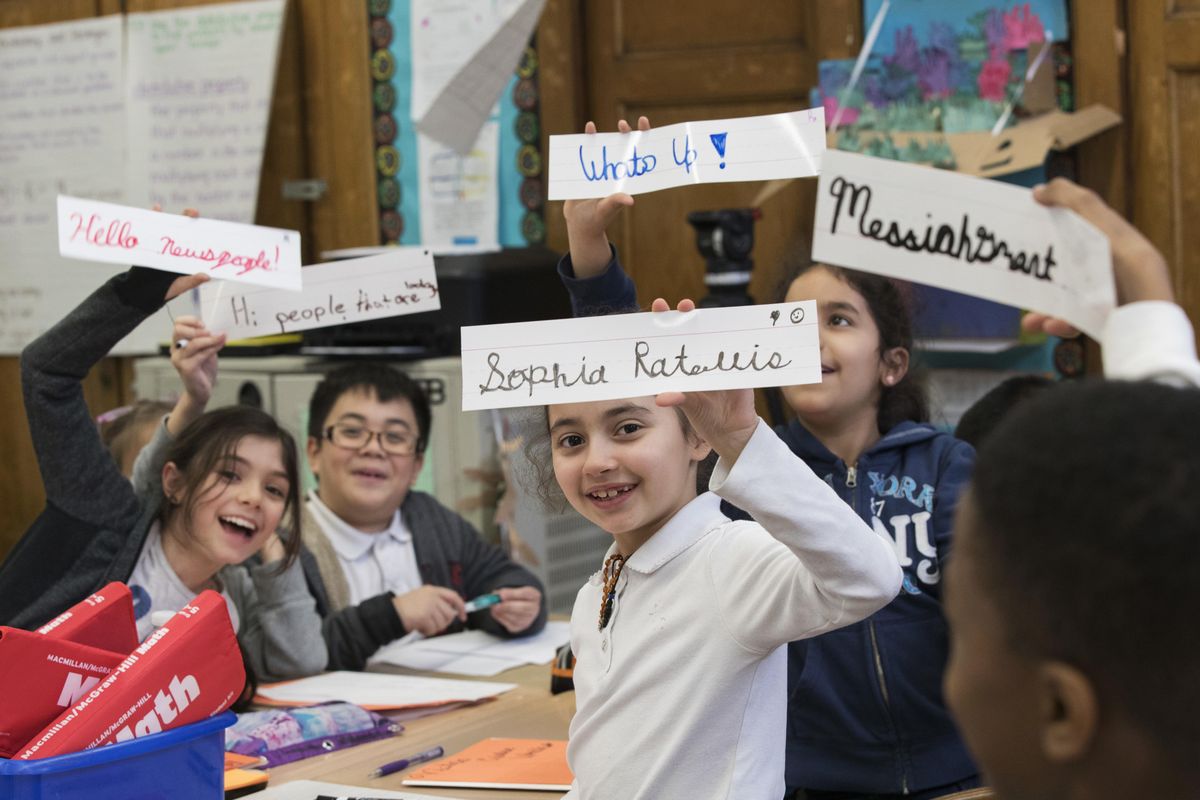 Students display some of their cursive writing work and exercises at P.S. 166 in the Queens borough of New York. Cursive writing is looping back into style in schools across the country after a generation of students who know only keyboarding, texting and printing out their words longhand. (Mary Altaffer / Associated Press)