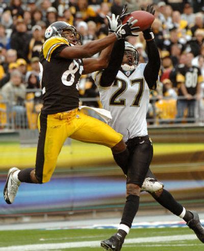 
Jaguars cornerback Rashean Mathis, right, breaks up a pass intended for Steelers receiver Antwaan Randle El in the fourth quarter. In overtime, Mathis returned an interception for a touchdown that gave Jacksonville the victory. 
 (Associated Press / The Spokesman-Review)