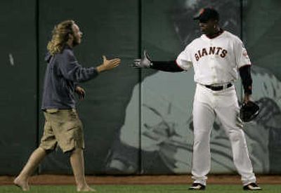 
A fan greets Barry Bonds during the Giants' game against Arizona on Friday.Associated Press
 (Associated Press / The Spokesman-Review)