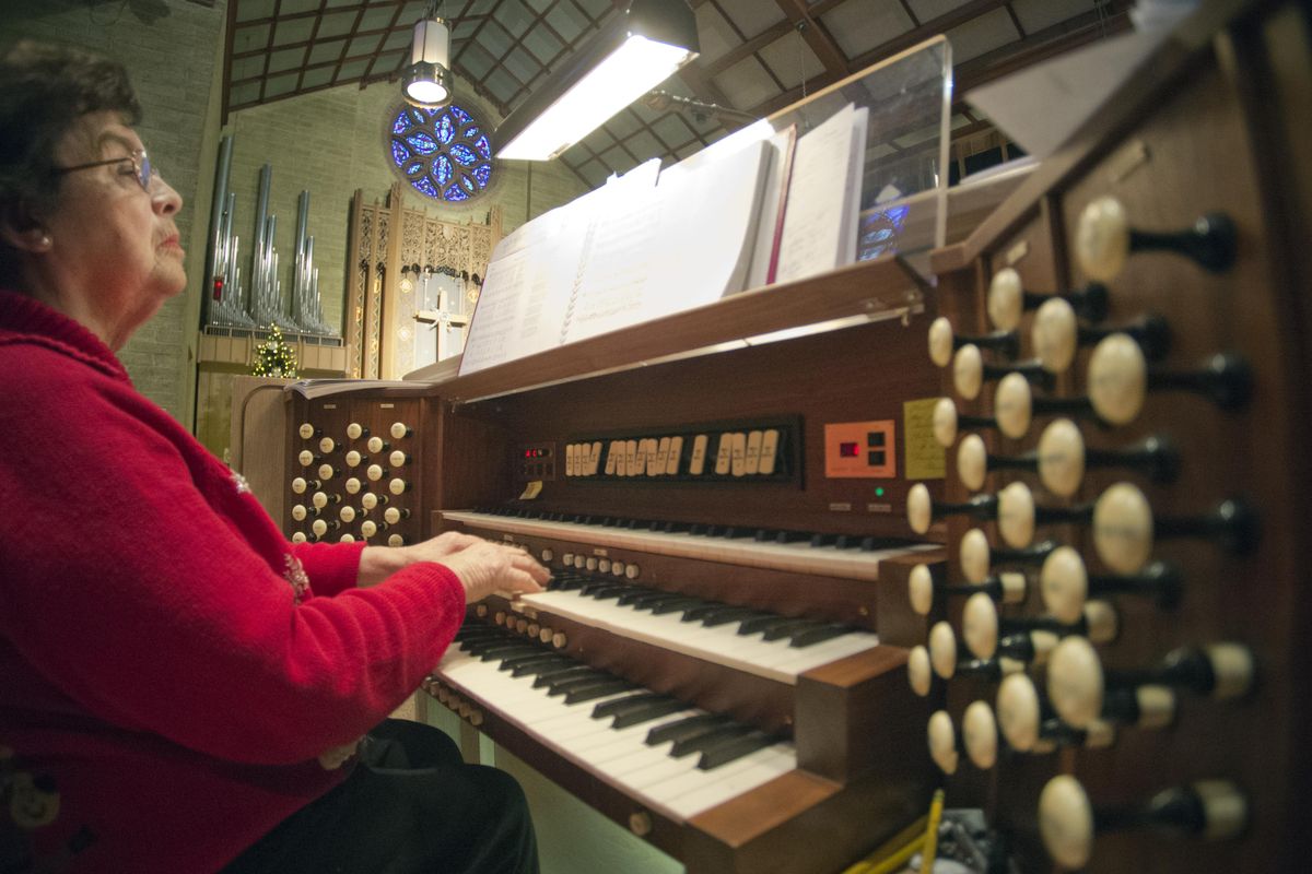 Alice Hostetter, organist at Central Lutheran Church in downtown Spokane, accompanies a Christmas carol on the 1966 Aeolian-Skinner pipe organ Saturday during the Organ Walk, a three-church event organized by the American Guild of Organists. (Jesse Tinsley / The Spokesman-Review)