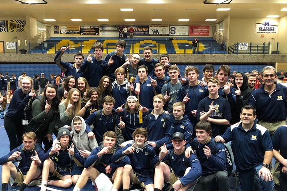 4A district wrestling champions Mead Panthers poses at the medal’s stand at Mead HS on Feb. 3, 2018. (Dave Nichols / The Spokesman-Review)