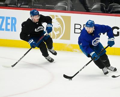 Colorado Avalanche defenseman Cale Makar, left, and center Nathan MacKinnon skate during practice at Ball Arena June 12, 2022.  (Andy Cross/TRIBUNE NEWS SERVICE)