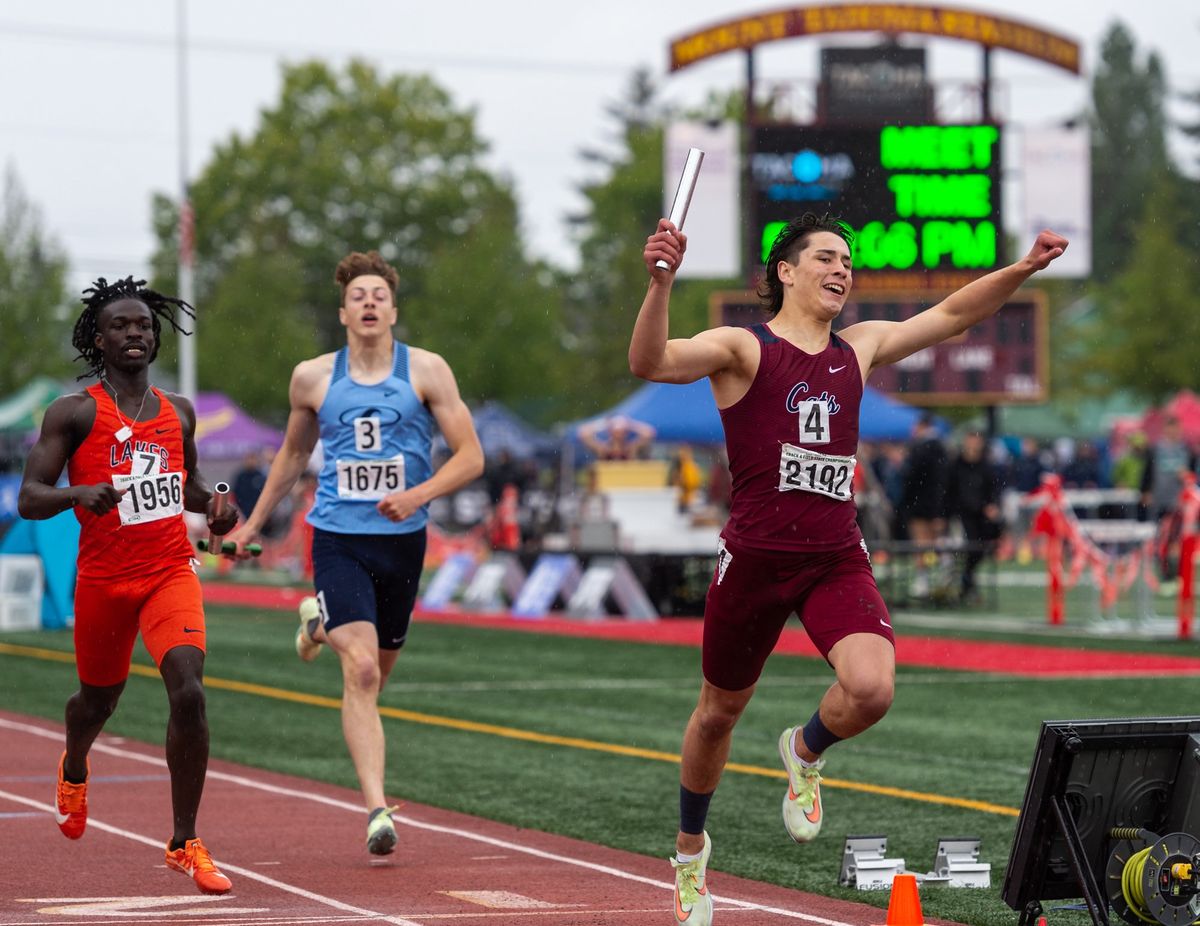Mount Spokane’s Bradley Runge raiseshis arms in celebration as he crosses the finish line in first in the 3A Boys 4x400 Relay at the 4A/3A/2A State Track and Field Championships on Saturday, May 28, 2022, at Mount Tahoma High School in Tacoma.  (Joshua Hart/For The Spokesman-Review)