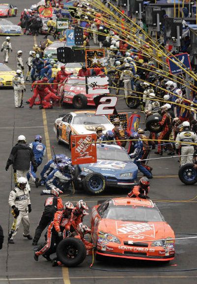 
As NASCAR cars have become more technologically advanced, success or failure in the pits has never been so important.
 (File photos The Associated Press / The Spokesman-Review)