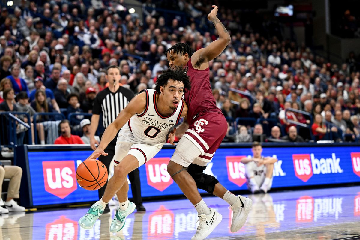 Gonzaga Bulldogs guard Ryan Nembhard (0) drives the ball against the Santa Clara Broncos during the second half of a college basketball game on Saturday, Feb. 24, 2024, at McCarthey Athletic Center in Spokane, Wash. Gonzaga won the game 94-81.  (Tyler Tjomsland/The Spokesman-Review)