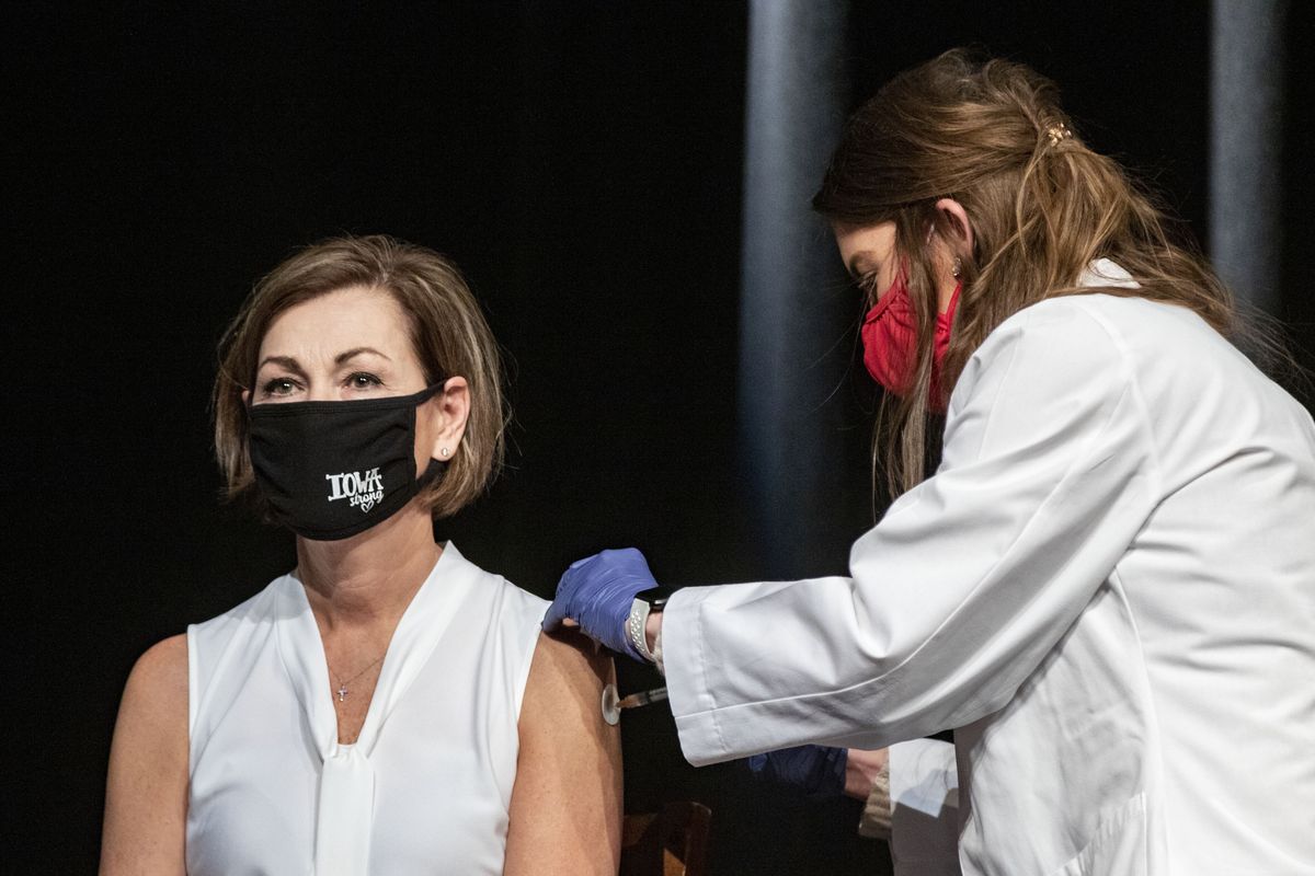 FILE - In this March 3, 2021, file photo, Iowa Governor Kim Reynolds gets the Johnson &amp; Johnson COVID-19 vaccine during a news conference at Iowa PBS in Johnston, Iowa. Reynolds, a Republican, is trying win over the one-third of adult Iowans who won't commit to getting a vaccine by emphasizing that the shots will help return life to normal. A new poll from The Associated Press-NORC Center for Public Affairs Research shows that the percentage of Americans resisting getting inoculated has shrunk in the past few months. But it’s still not enough to pull America out of the pandemic, and reach herd immunity.  (Zach Boyden-Holmes)