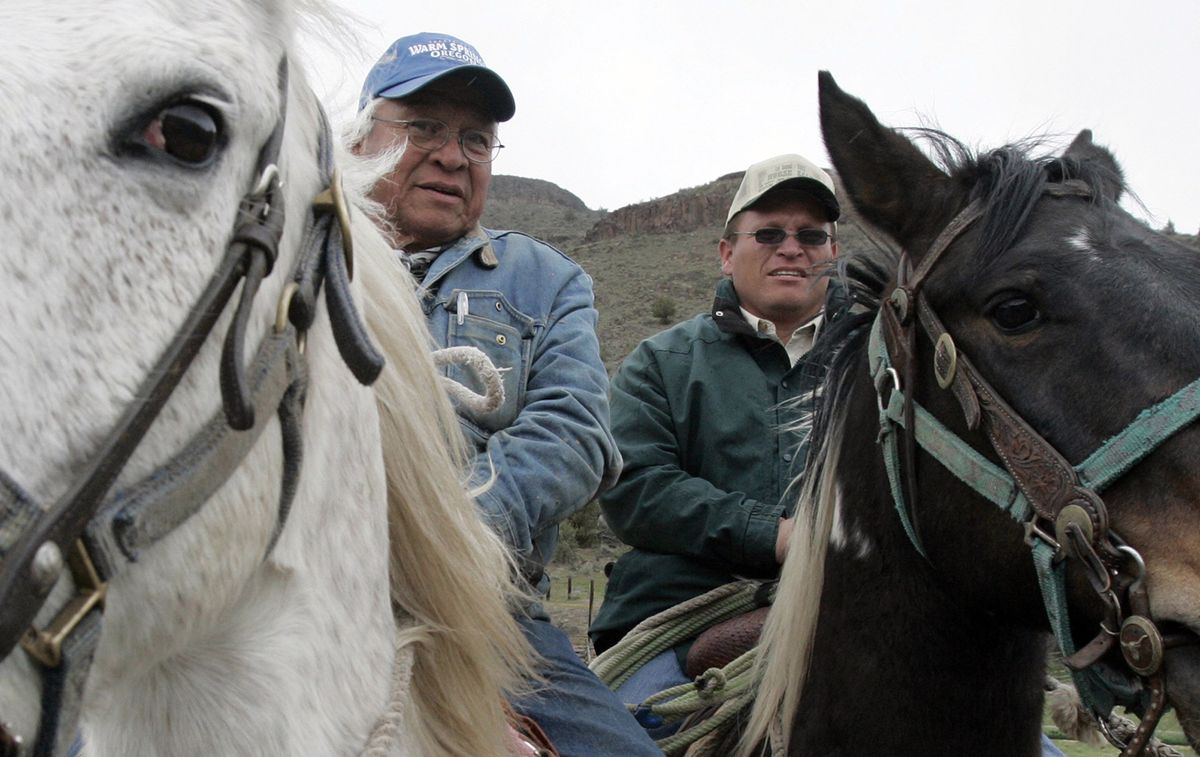 Buck Smith, left, and his son, Jason, are tribal horsemen who know the range, the animals, and how to work with and train them. (Alan Berner / The Spokesman-Review)