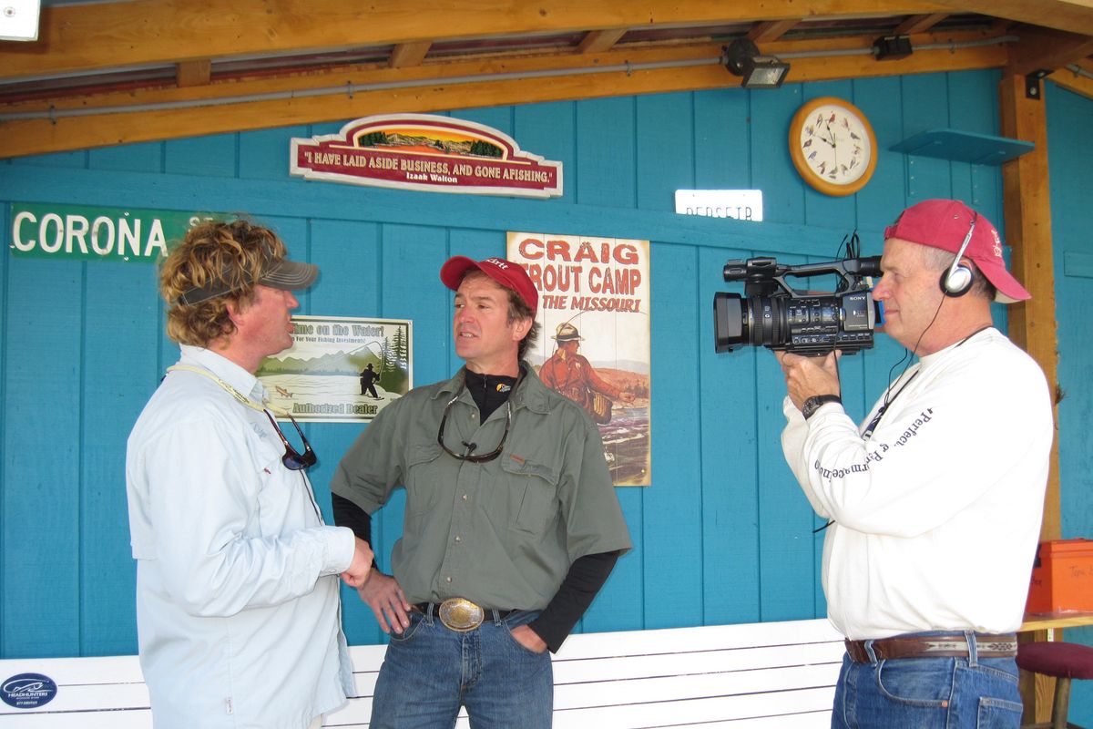 Bob Asbury, producer of Columbia Country sport fishing television show, mans the video camera as Montana angler Rich Birdsell, center, interviews a Missouri River guide for an upcoming episode of Trout TV, a fly-fishing show that will debut on Inland Northwest cable TV markets in February.