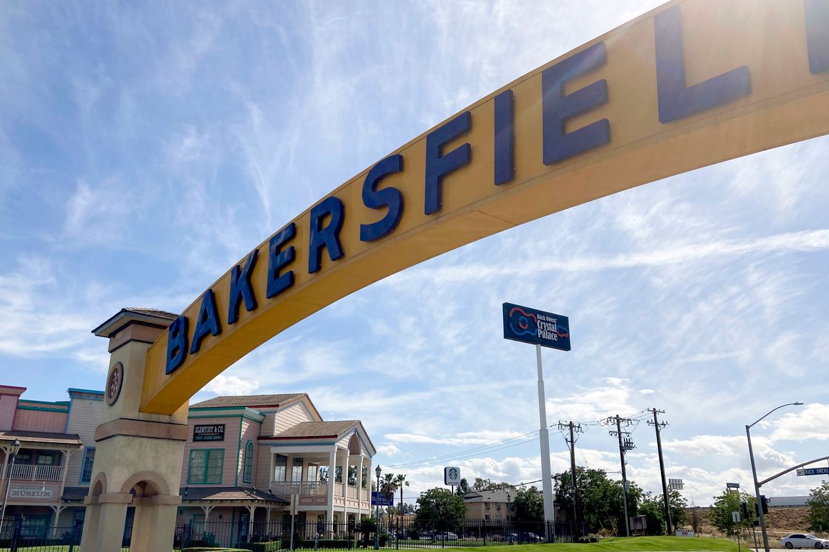 A sign for Bakersfield, Calif., is displayed over Sillect Avenue at Buck Owens Boulevard on April 20, 2022. House Republican leader Kevin McCarthy is a son of California’s Central Valley, a farming and oil-pumping heartland. It