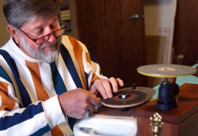 
Tom Ellis uses his homemade sharpener to fix a dull carving blade during a carving class at the Spokane Art Supply in Spokane Valley. Below, Waiting for Goldilocks is one of Tom Ellis's wood carvings. 
 (Liz Kishimoto photos/ / The Spokesman-Review)