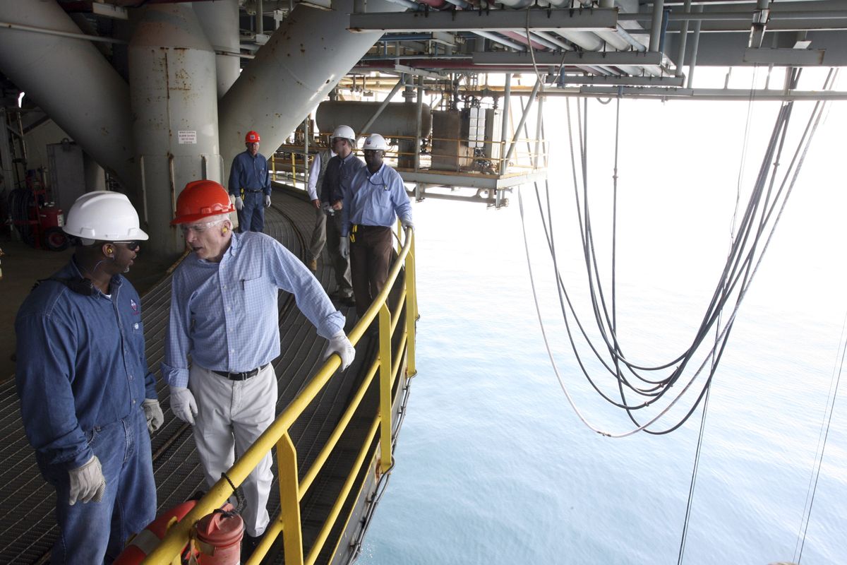 Sen. John McCain tours the Chevron Genesis oil rig platform with Joe St. Ann, the company’s offshore installation manager, in the Gulf of Mexico near New Orleans on Tuesday. (Mary Altaffer / The Spokesman-Review)