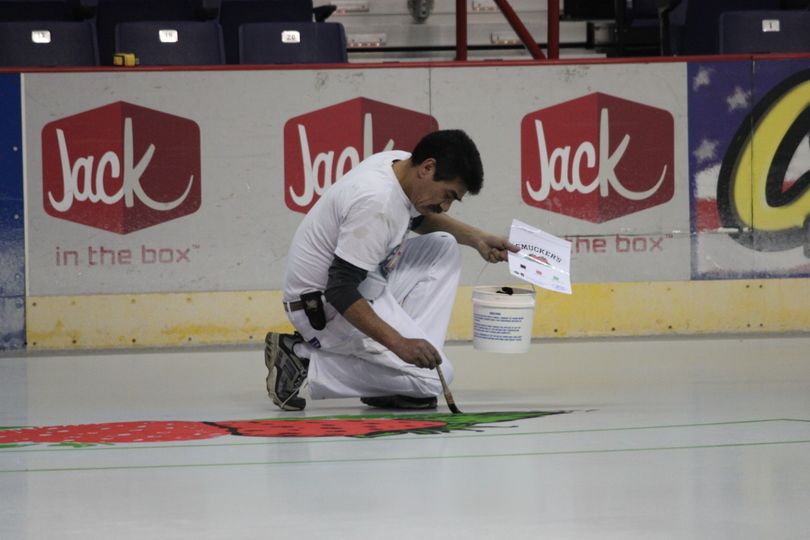 Ruben Marcilla paint the ice at Spokane Veterans Memorial Arena. Photo courtesy of Spokane Regional Convention & Visitors Bureau.