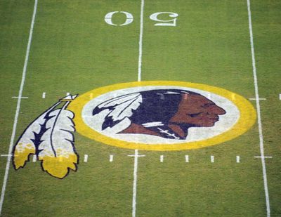 In this Aug. 28, 2009 file photo, the Washington Redskins logo is seen on the field before the start of a preseason NFL football game in Landover, Md.  (AP file photo)