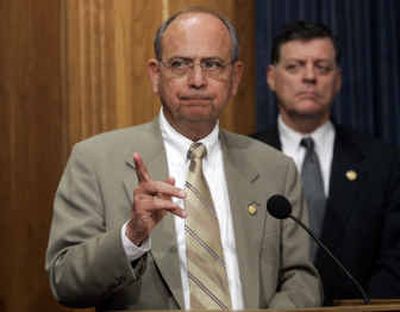
House ethics committee chairman Rep. Doc Hastings, R-Wash., gestures during a news conference on Wednesday in Washington. At right is Rep. Tom Cole, R-Okla. 
 (Associated Press / The Spokesman-Review)