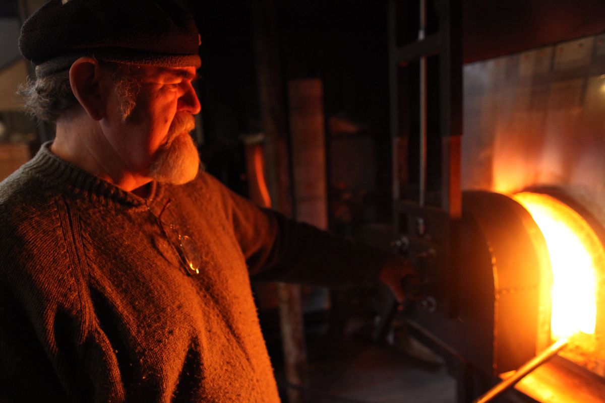 Robert Adamson shows how to make a glass flower stand at Island Art Glass near Freeland on Whidbey Island. Adamson and his wife, Janis Swalwell, own the glass blowing facility and studio that is open on weekends or weekdays by appointment. (Erika Schultz / The Spokesman-Review)