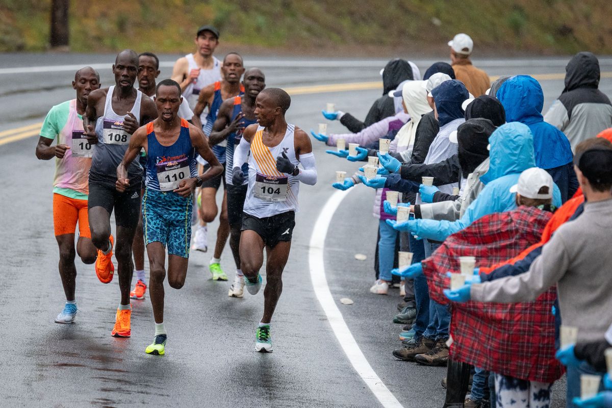 Eventual Men’s Elite winner Tebello Ramakogoana (104) from Lesotho, moves to the head of the pack along North Government Way. He would later pull ahead at the bottom of Doomsday Hill and was not challenged again during Bloomsday, Sunday, May 5, 2024.  (COLIN MULVANY/THE SPOKESMAN-REVI)