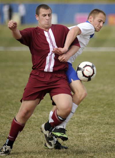 University’s Paul Sindlinger, left, and Mead’s Jay Jansen compete for the ball in Friday’s soccer match. (Colin Mulvany)