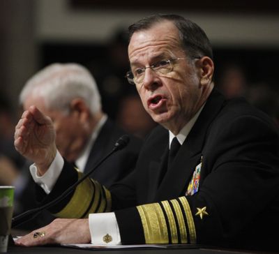 Joint Chiefs Chairman Adm. Michael Mullen, right, accompanied by Defense Secretary Robert Gates, testifies  Tuesday  during a Senate Armed Services Committee hearing.  (Associated Press)