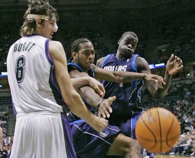 
Milwaukee rookie center Andrew Bogut, left, fights Dallas' Josh Powell, center, and DeSagana Diop for a loose ball in the second quarter. 
 (Associated Press / The Spokesman-Review)