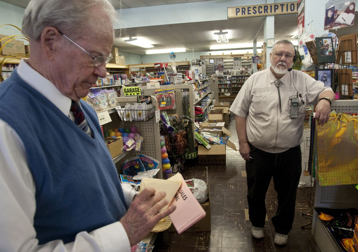 Bill McDermott, left, a drugstore closing consultant, is helping pharmacist Art Tyrrell shut down the Altamont Pharmacy  at 928 S. Perry St. The store’s pharmacy, in operation for 99 years, will combine its operations with the Safeway pharmacy on 29th Avenue next month.  (Colin Mulvany / The Spokesman-Review)