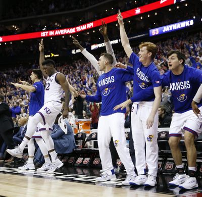 Kansas players celebrate during the second half of the NCAA college basketball championship game against West Virginia in the Big 12 men's tournament Saturday, March 10, 2018, in Kansas City, Mo. (Charlie Riedel / AP)