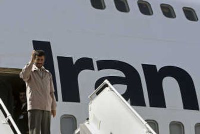 
Iranian President Mahmoud Ahmadinejad  prepares to board his plane Sunday in Tehran. Associated Press
 (Associated Press / The Spokesman-Review)