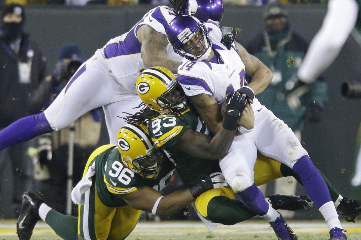 Green Bay defenders had Minnesota quarterback Joe Webb (14) scrambling throughout the Packers’ win. (Associated Press)