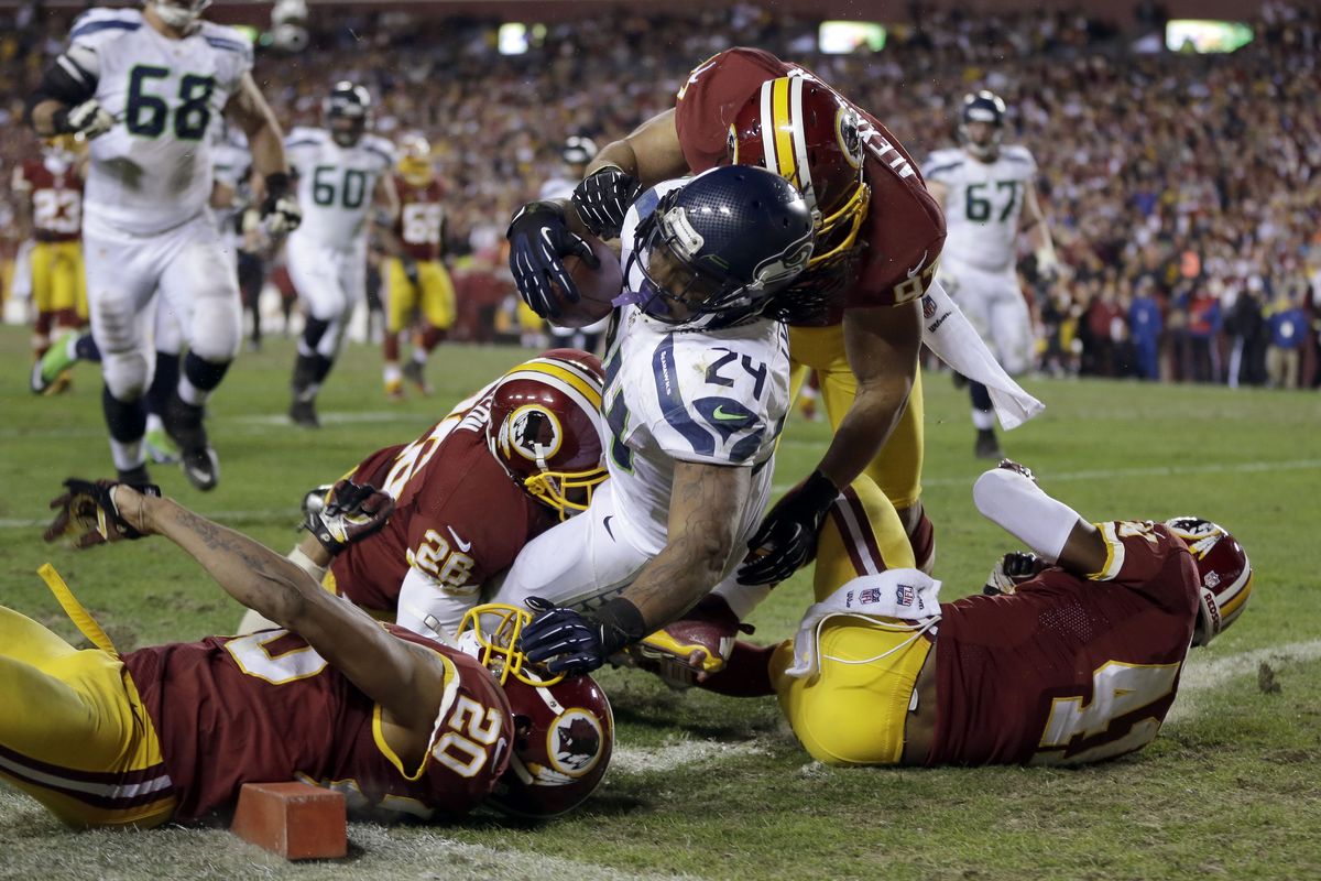 Seahawks running back Marshawn Lynch tumbles into the end zone for the go-ahead touchdown. Lynch rushed for 132 yards Sunday. (Associated Press)