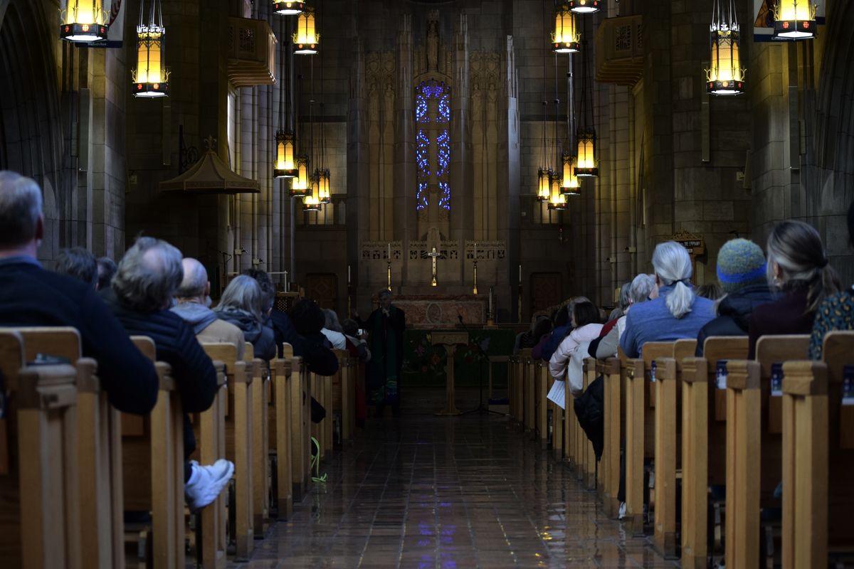 Groups gather at The Cathedral of St. John the Evangelist to pray for those in Minneapolis who are facing an influx of ICE agents in their community and to listen to instructions about how to interact with ICE should they come across them in Spokane.  (Alexandra Duggan / The Spokesman-Review)