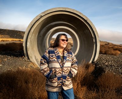 Roylene Comes at Night is Washington state’s conservationist for the USDA’s Natural Resources Conservation Service. She is standing earlier this month in front of some of the pipe used to move surface water in the Columbia Basin Project.  (Jesse Tinsley/THE SPOKESMAN-REVI)