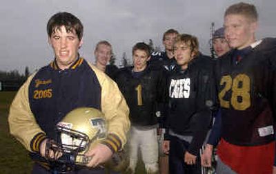 
Jesse Dunham, left, plays football for the Timberlake Tigers in Spirit Lake. At right are some of his teammates. 
 (Jesse Tinsley / The Spokesman-Review)