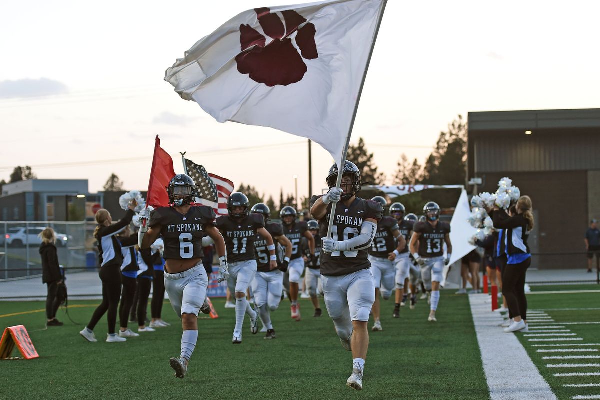 Mt. Spokane Wildcats runs out onto the field for a game against the Lewis and Clark Tigers in the first half at Union Stadium on Friday Sept. 16, 2022 in Spokane WA.  (James Snook/For The Spokesman-Review)