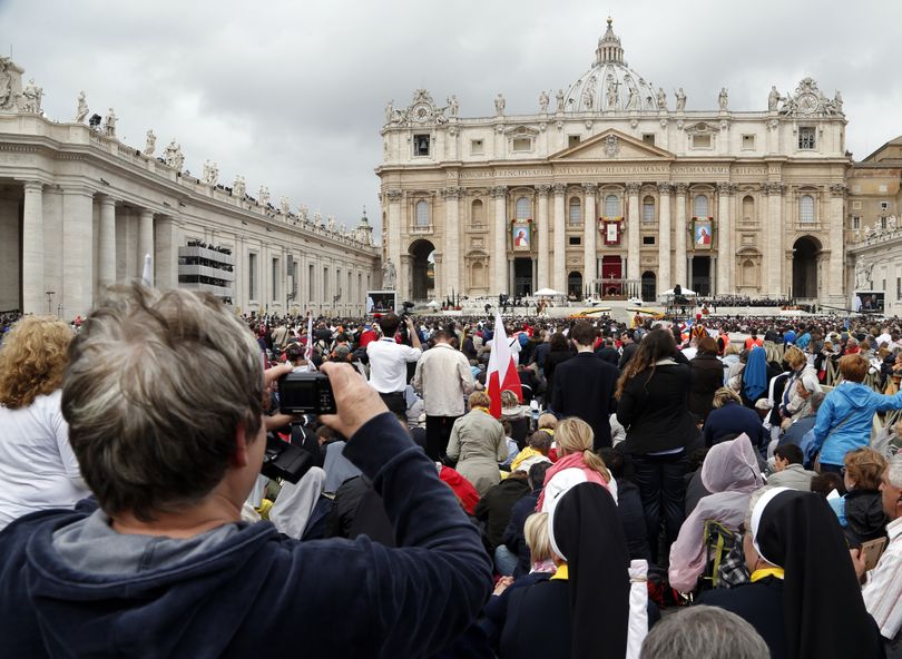 Faithful fill St. Peter's Square during a solemn ceremony led by Pope Francis, at the Vatican, Sunday, April 27, 2014. Pope Francis has declared his two predecessors John XXIII and John Paul II saints in an unprecedented canonization ceremony made even more historic by the presence of retired Pope Benedict XVI. (Domenico Stinellis / Associated Press)