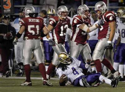 
UW quarterback Isaiah Stanback meets the WSU defensive line after being dumped for a third-down loss in the second half.
 (Christopher Anderson/ / The Spokesman-Review)