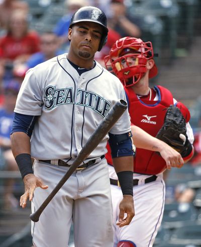 Mariners slugger Nelson Cruz walks away after striking out during the eighth inning. (Associated Press)