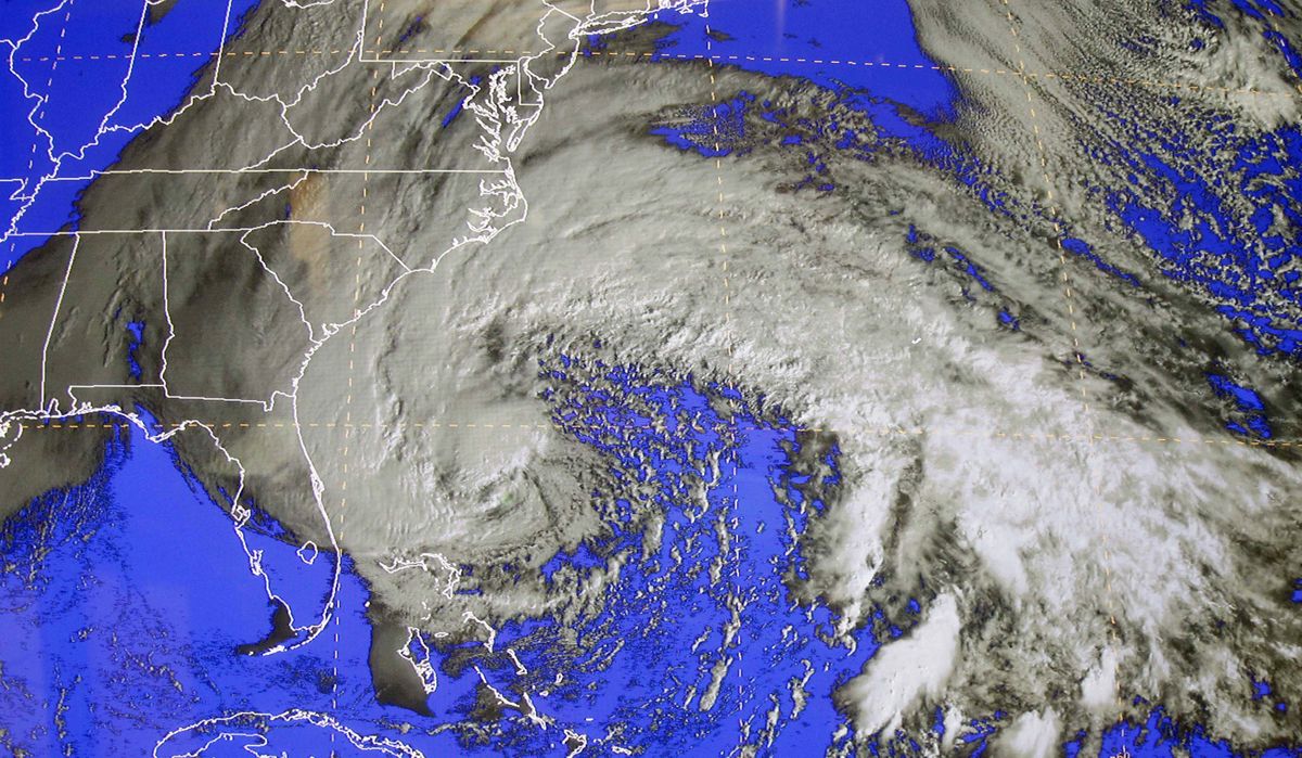 A satellite image of Sandy is shown at the National Hurricane Center in Miami, Saturday, Oct. 27, 2012. Early Saturday, the storm was about 335 miles southeast of Charleston, S.C. Tropical storm warnings were issued for parts of Florida
