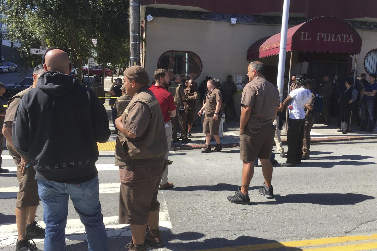 UPS workers gather outside after a reported shooting at a UPS warehouse and customer service center in San Francisco on Wednesday, June 14, 2017. San Francisco police confirmed a shooting at the facility in the Potrero Hill neighborhood but didnt release information on injuries or the shooter. (Eric Risberg / AP)
