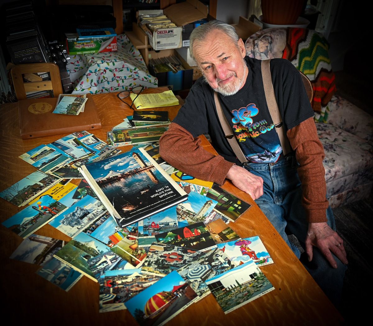 Jerry Smith, of Spokane, displays some 116 unique postcards depicting Expo '74. In the center of the table is the official Expo commemorative book he found for a few quarters at a thrift store.  (DAN PELLE/THE SPOKESMAN-REVIEW)