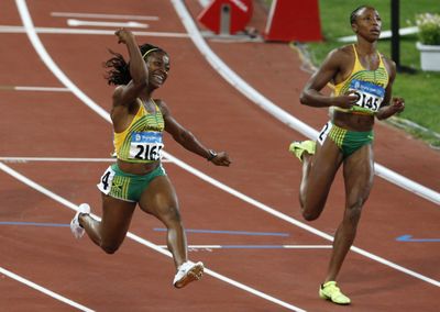Jamaica’s Shelly-Ann Fraser, left, led an unprecedented sweep of the women’s 100-meter dash for her country on Sunday. The 21-year-old sailed to the finish line in a personal-best time of 10.78 seconds.   (Associated Press / The Spokesman-Review)