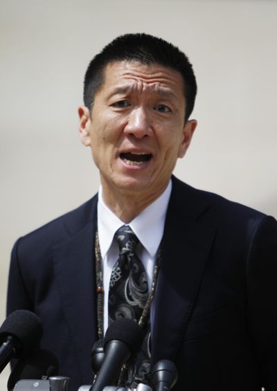In this March 15, 2017, file photo, Hawaii Attorney General Douglas Chin speak at a press conference outside the federal courthouse in Honolulu. The top legal officers in 18 states and the District of Columbia have asked Congress to pass legislation prohibiting discrimination against transgender service members with Chin sending the letter dated Thursday, July 27, 2017, in response to President Donald Trump’s announcement, via Twitter a day earlier, that he would ban transgender people in the military. (Marco Garcia / Associated Press)