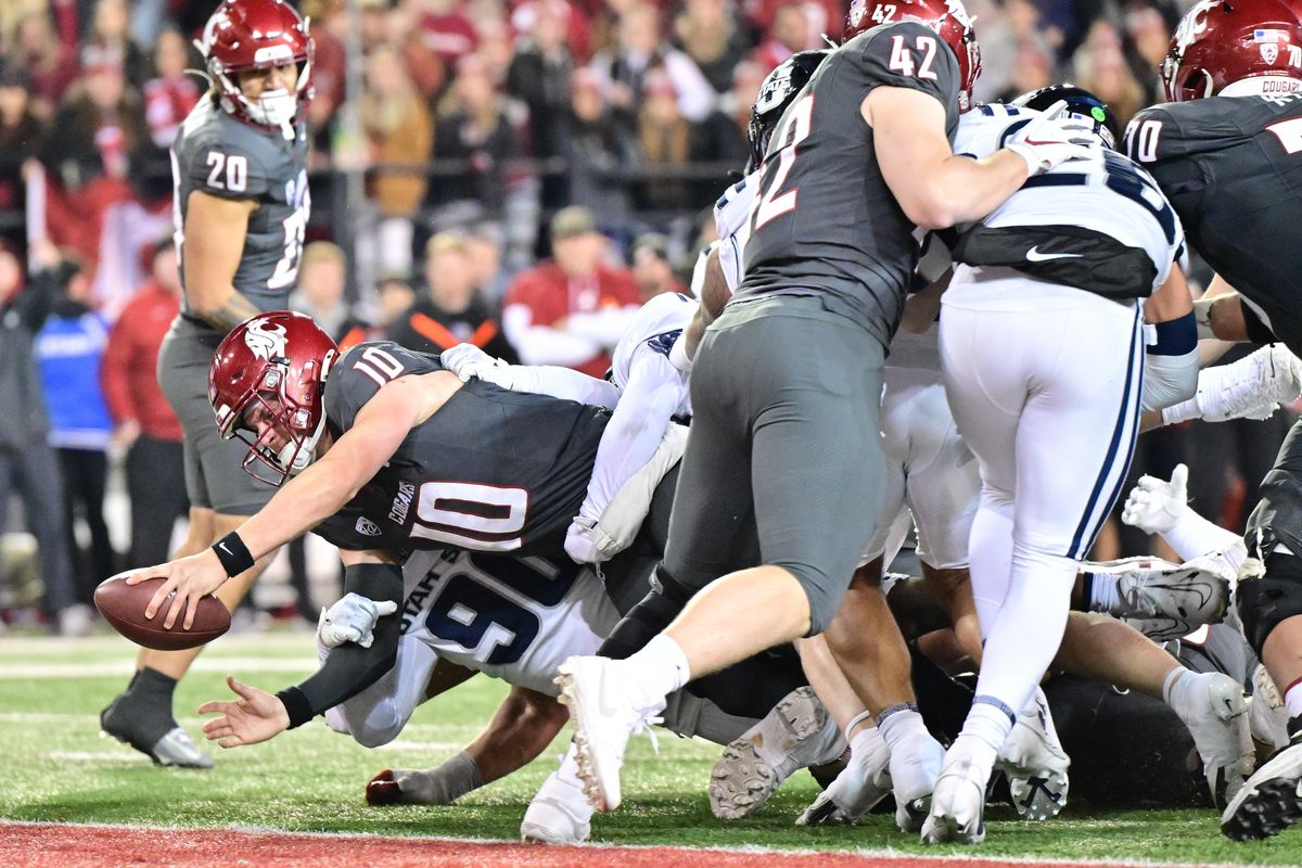 Washington State Cougars quarterback John Mateer (10) dives for a touchdown against the Utah State Aggies during the second half of a college football game on Saturday, Nov. 9, 2024, at Gesa Field in Pullman, Wash. WSU won the game 49-28.  (Tyler Tjomsland/The Spokesman-Review)