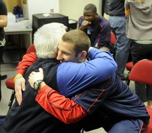 Gonzaga player Andrew Sorenson gets a bear hug from Steve Hertz, Director of Athletic Relations for Gonzaga after the Zags lost to Davidson, March 21, 2008 in Raleigh,NC.  Hertz thanked Sorenson for his enthusium.  DAN PELLE The Spokesman-Review (Dan Pelle / The Spokesman-Review)