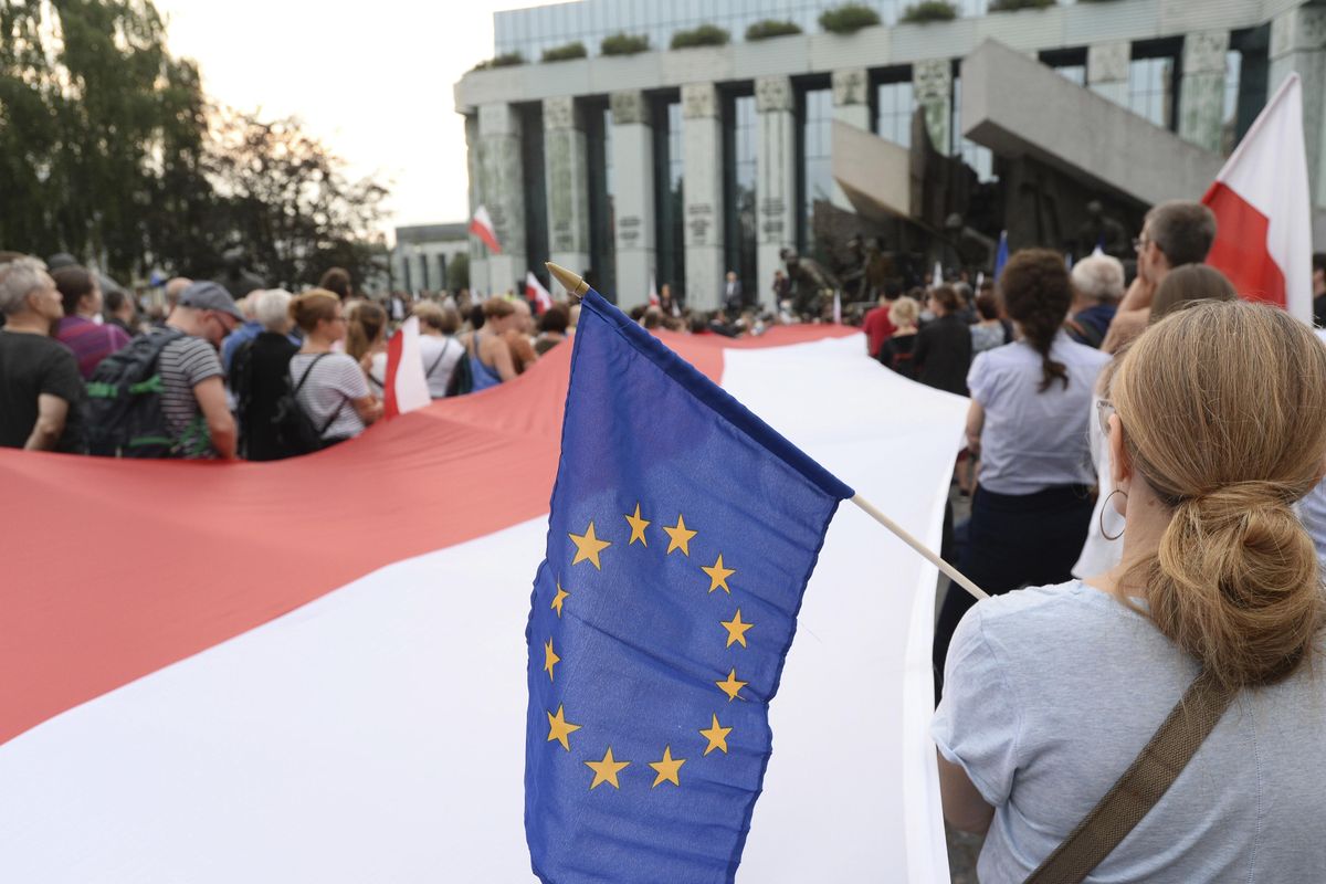 Opposition supporters protest in front of the Supreme Court against a law on court control, in Warsaw, Poland, Friday, July 21, 2017. The bill on the Supreme Court has drawn condemnation from the European Union and has led to street protests in Warsaw. (Alik Keplicz / Associated Press)