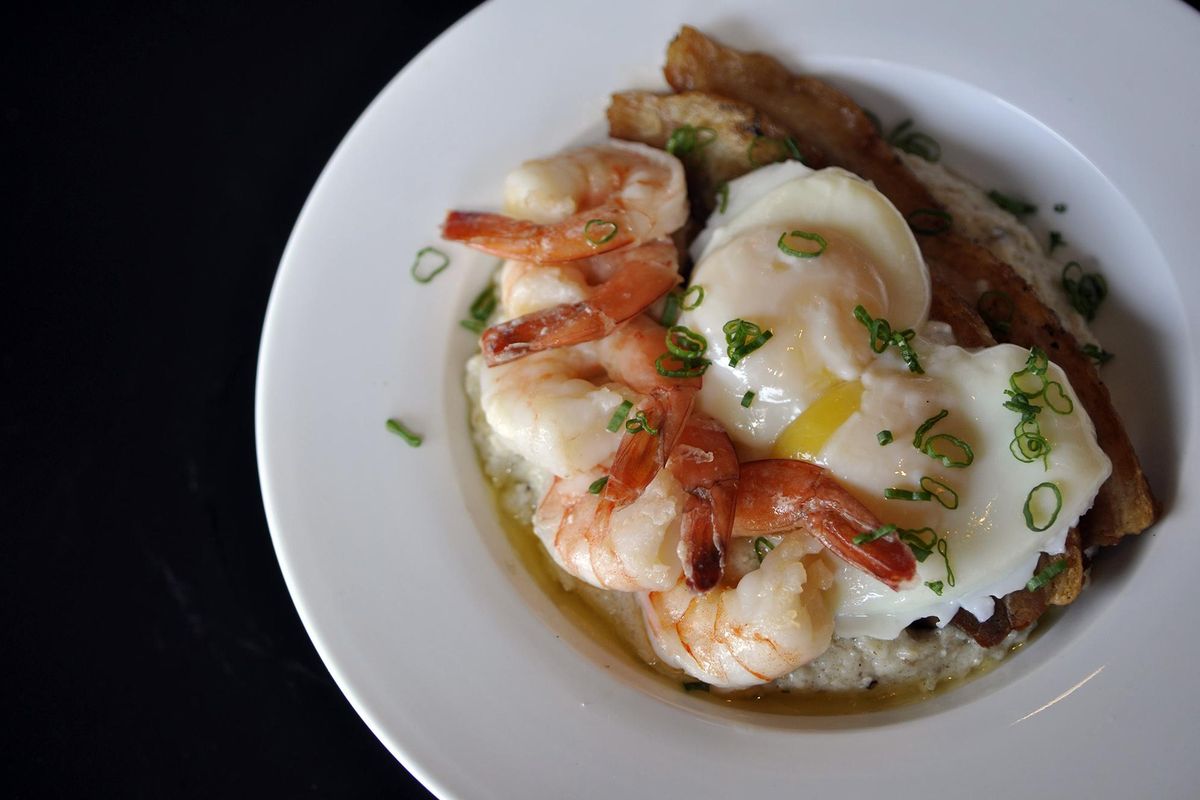 The Wild Rice Grits dish at the newly opened Honey Eatery features grilled shrimp, honey-glazed porchetta and a poached egg for $11. (Adriana Janovich / The Spokesman-Review)