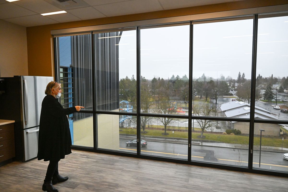 Native Project CEO Toni Lodge looks out onto Maxwell Avenue from the top floor of the new Native Project building at the city aquatics center at Maxwell and Elm Street on Friday in north Spokane. The Native Project, is a large health care nonprofit that already has a large clinic nearby and will operate the new building as a youth outpatient treatment center.  (Jesse Tinsley/THE SPOKESMAN-REVIEW)