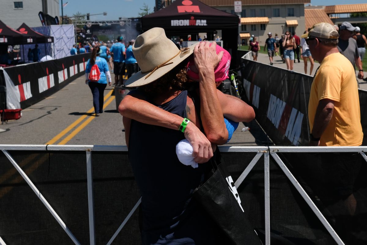 Carrie Lester embraces her husband Scott Defilippis after she won the the women