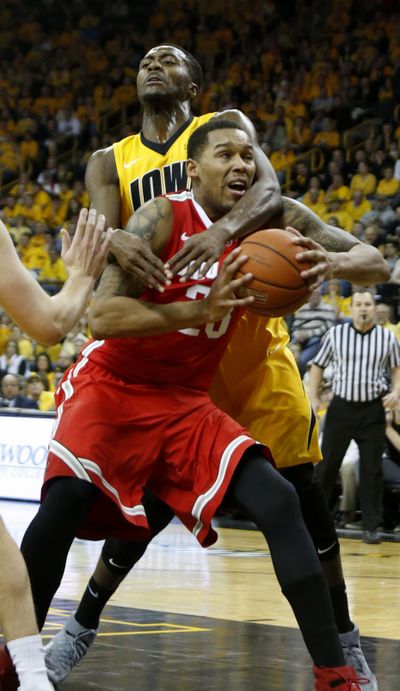 Iowa center Gabriel Olaseni had his hands full trying to stop Ohio State’s driving Amir Williams. (Associated Press)