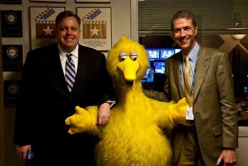 Wayne Hammon, Gov. Butch Otter's budget director, poses with Big Bird and Idaho Public Television General Manager Peter Morrill, right, before the taping Friday of the 